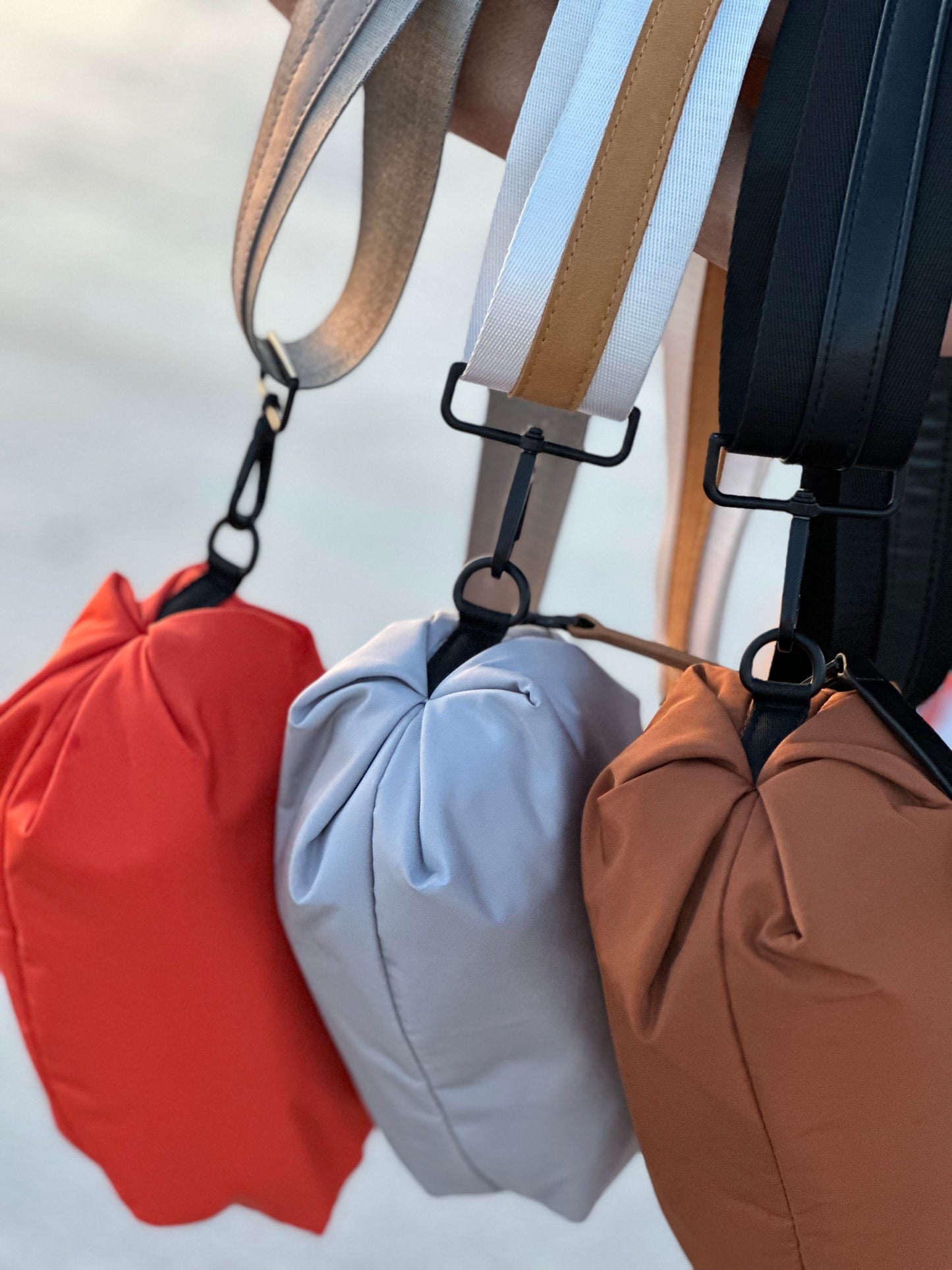 Collection of three Orlando Belt Bags in Orange, Gray and Brown