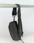 black nylon belt bag with black crossbody strap with black leather detail