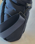 strap detail on large puffy navy nylon tote bag with crossbody strap