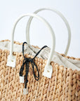 close-up of top of medium natural hyacinth straw tote with linen cinch top