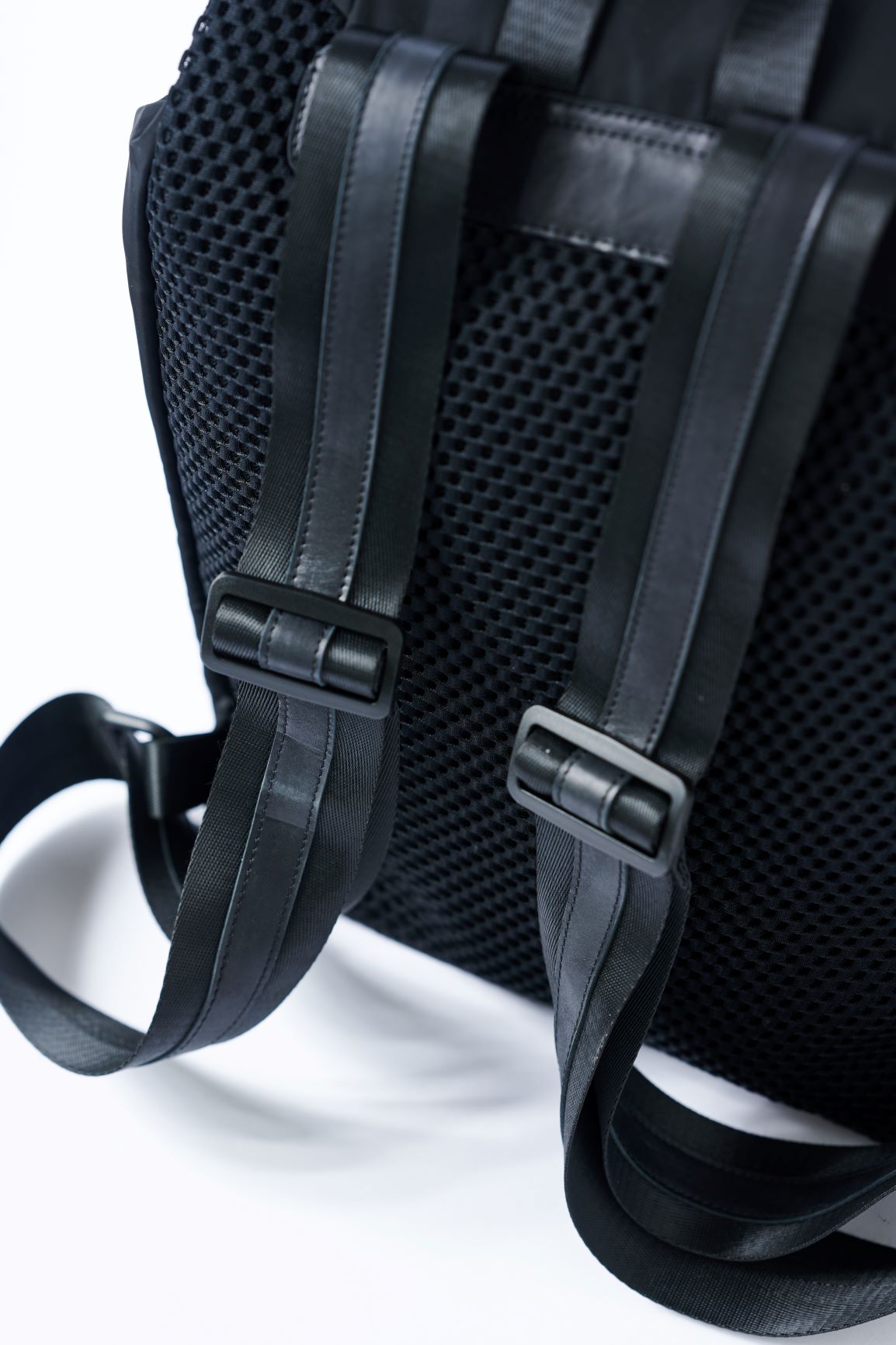 Padded mesh back on the Anya & Niki Delray Backpack - a black nylon backpack with glossy black lining.