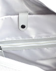 Close up of interior organization on the Callahan grey neoprene duffel bag from Anya & Niki.