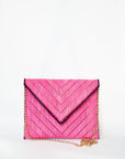 Bright pink woven raffia straw clutch with detachable gold chain strap.