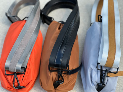 Collection of three Orlando Belt Bags in Orange, Gray and Brown