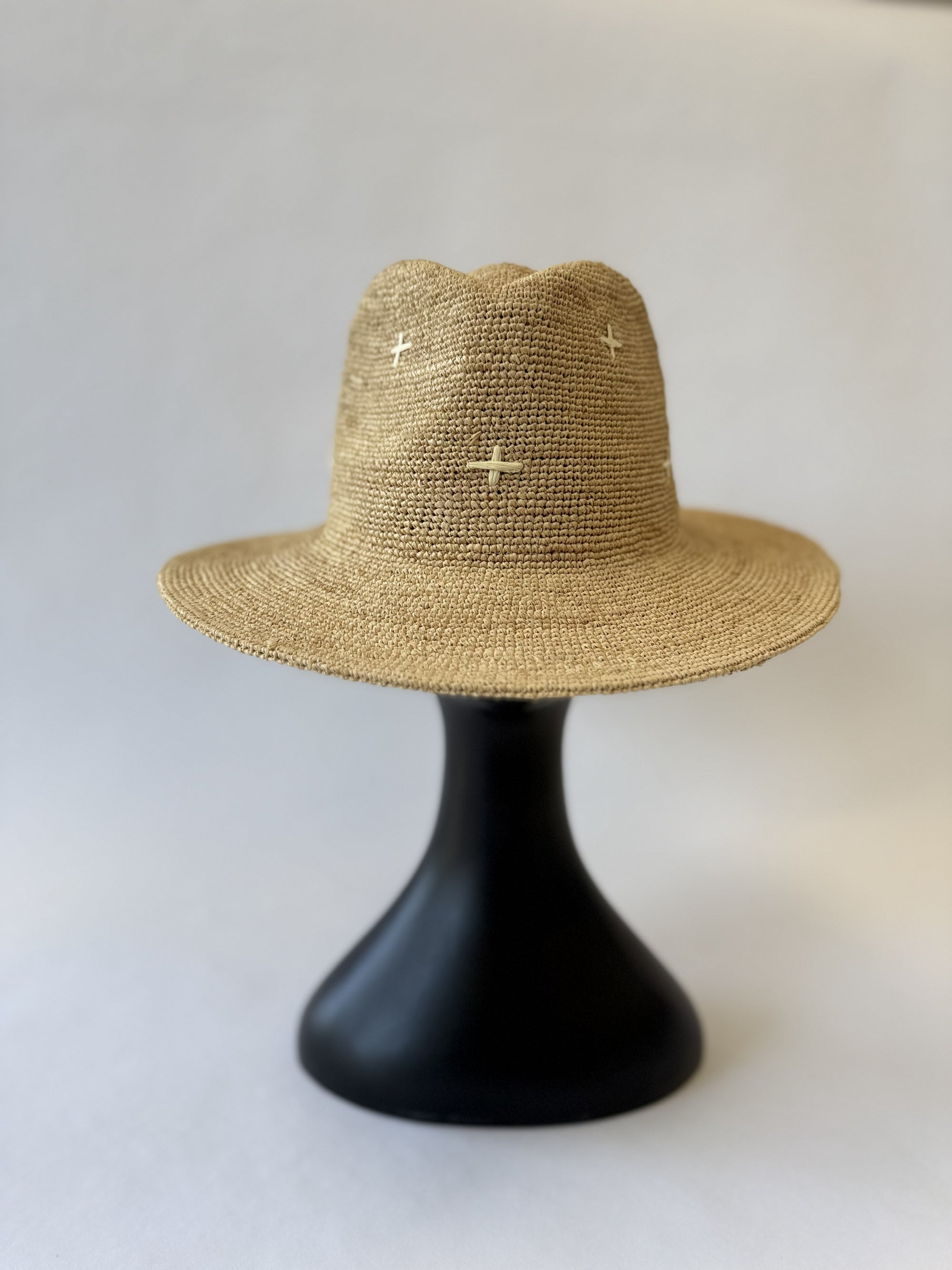 Straw fedora hat with white plus sign embroidery