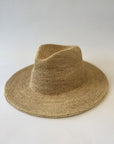 Beige fedora straw hat on a white background
