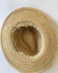 Inside of a straw fedora hat with adjustable band