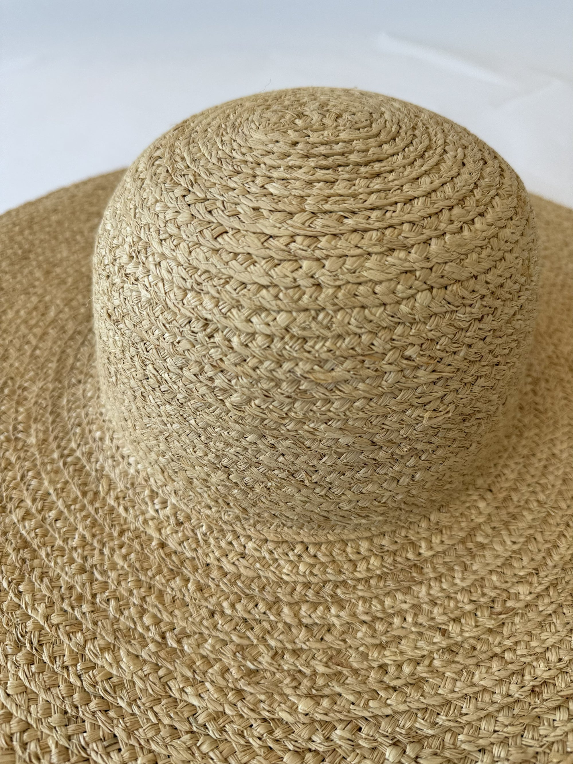 close up of beige straw hat
