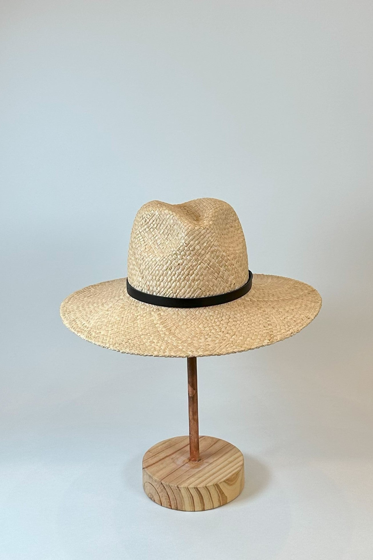 Straw panama hat with a black leather band