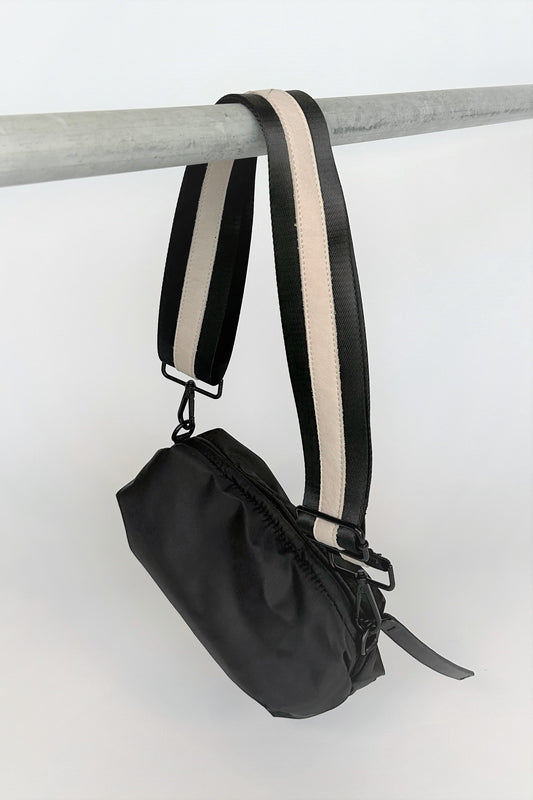black nylon belt bag with black crossbody strap with cream leather detail