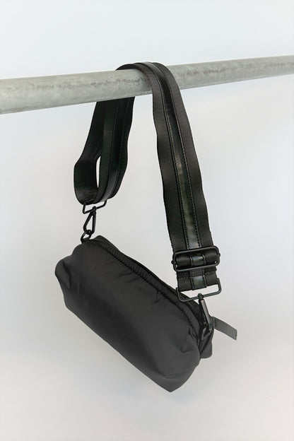 black nylon belt bag with black crossbody strap with shiny black leather detail