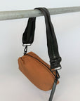 brown nylon belt bag with black crossbody strap and shiny black leather detail