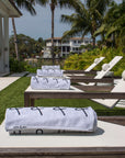 Anya & Niki beach towels on pool chairs