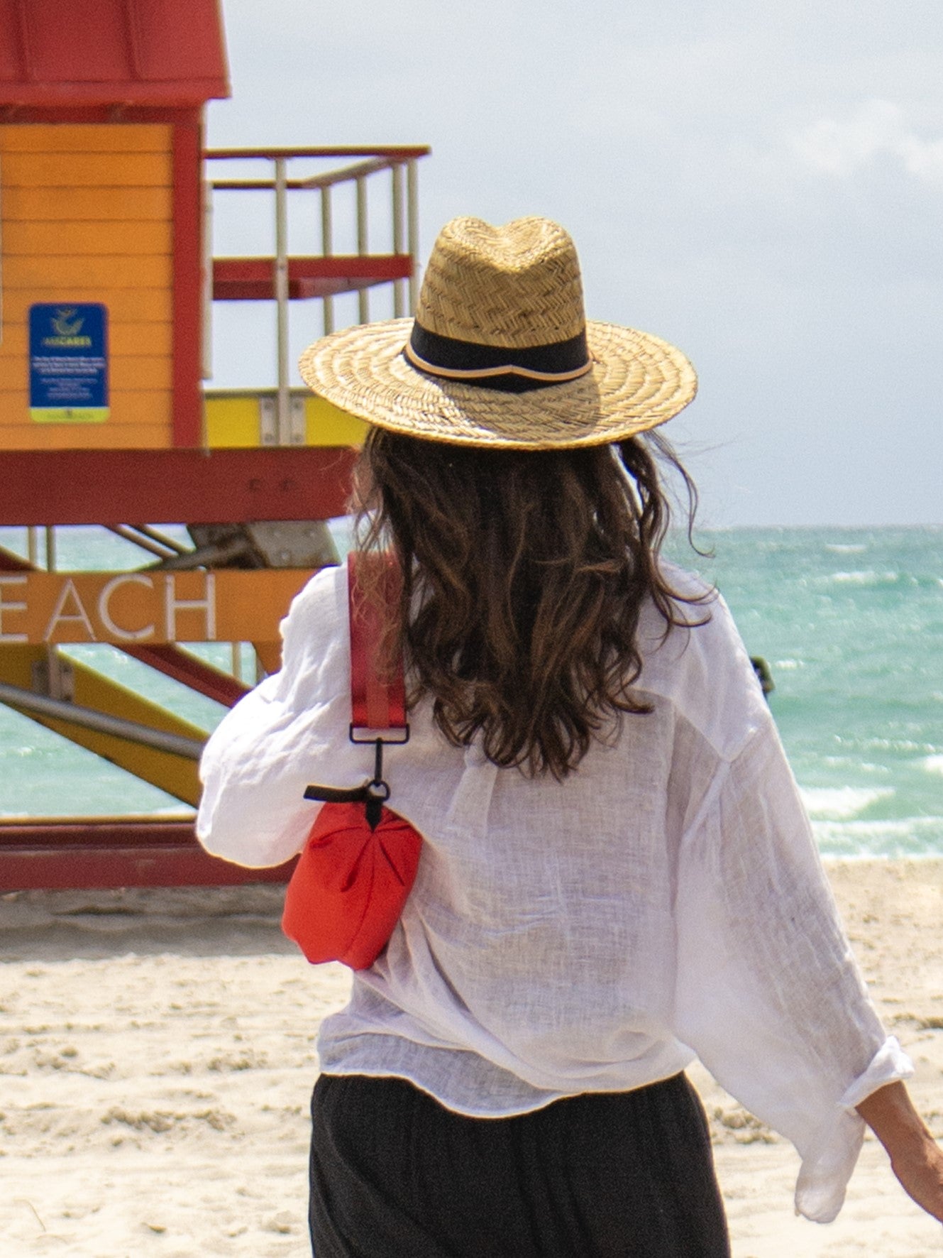 Person wearing the Orlando Crossbody Belt Bag in Red