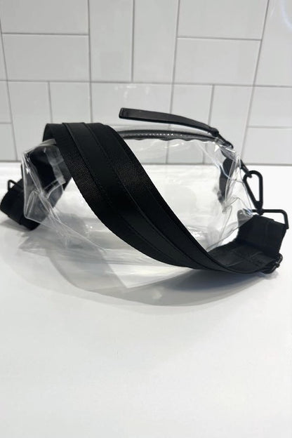 Clear belt bag with black crossbody strap with black leather detail