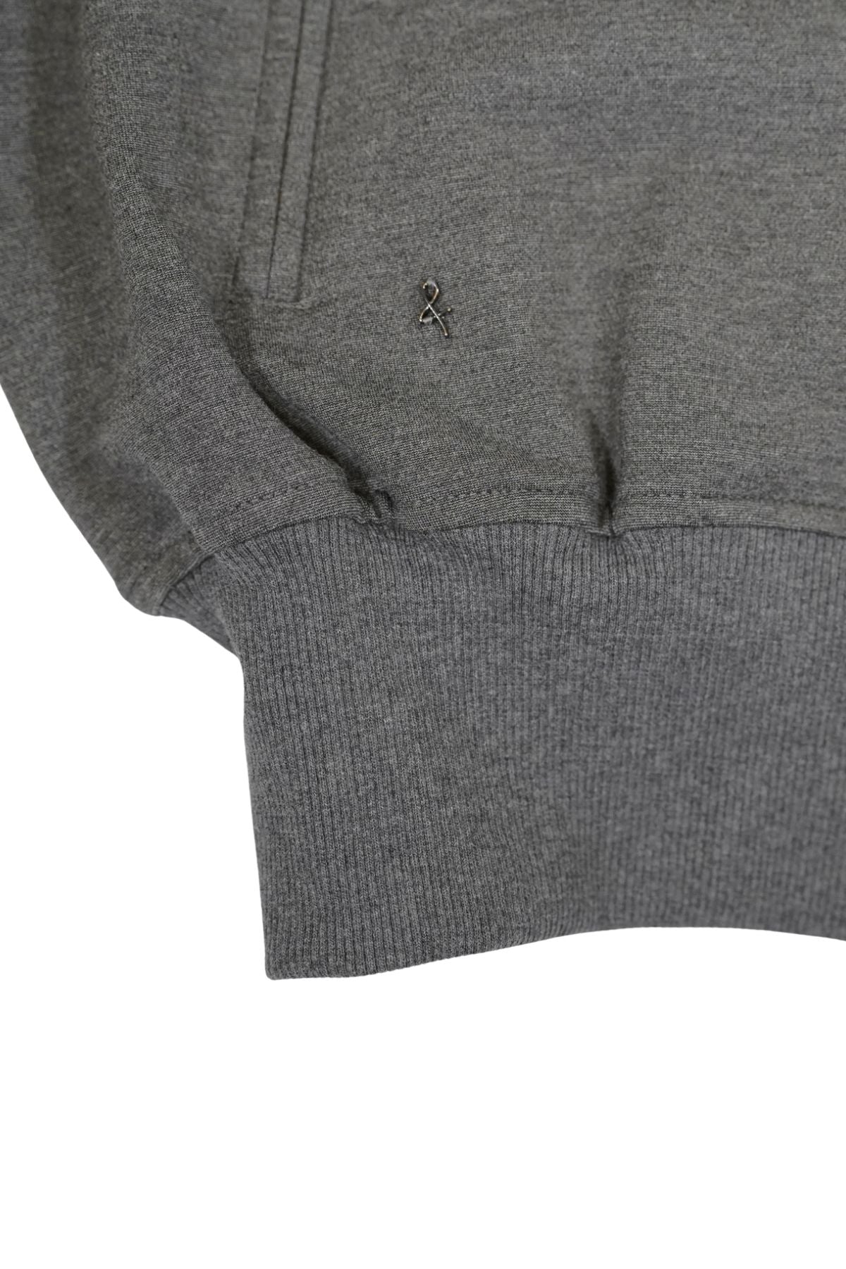 Close-up of a gray knit jacket with a &amp; logo on a white background