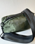 olive camo crossbody belt bag with black nylon strap with black leather details