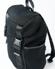 Black mesh backpack with leather details and shiny silver drawstring top.