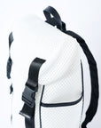 Close up of flap top on white mesh backpack with leather details and clear drawstring top.