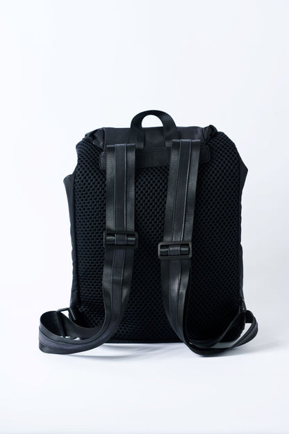 Padded mesh back on the Anya & Niki Delray Backpack - a black nylon backpack with glossy black lining.
