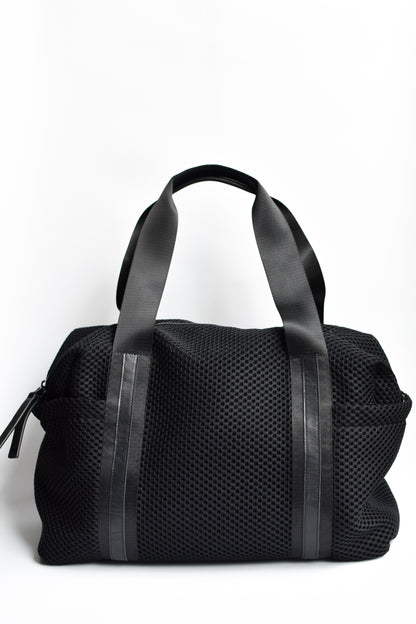 Black mesh duffel bag with leather trim details and black glossy liner. 