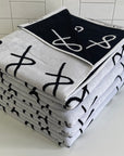 stack of Anya & Niki beach towels 