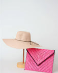 Collection of pink straw from Anya & Niki - the Big Hat and the Pixley Clutch