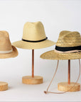 Collection of Anya & Niki straw hats, the Essential crochet straw hat with rope band, the Favorite Straw Hat with leather band, and the Tower Straw Hat with leather chin strap.