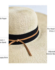 Natural floppy straw hat with black grosgrain ribbon and thin brown leather band.