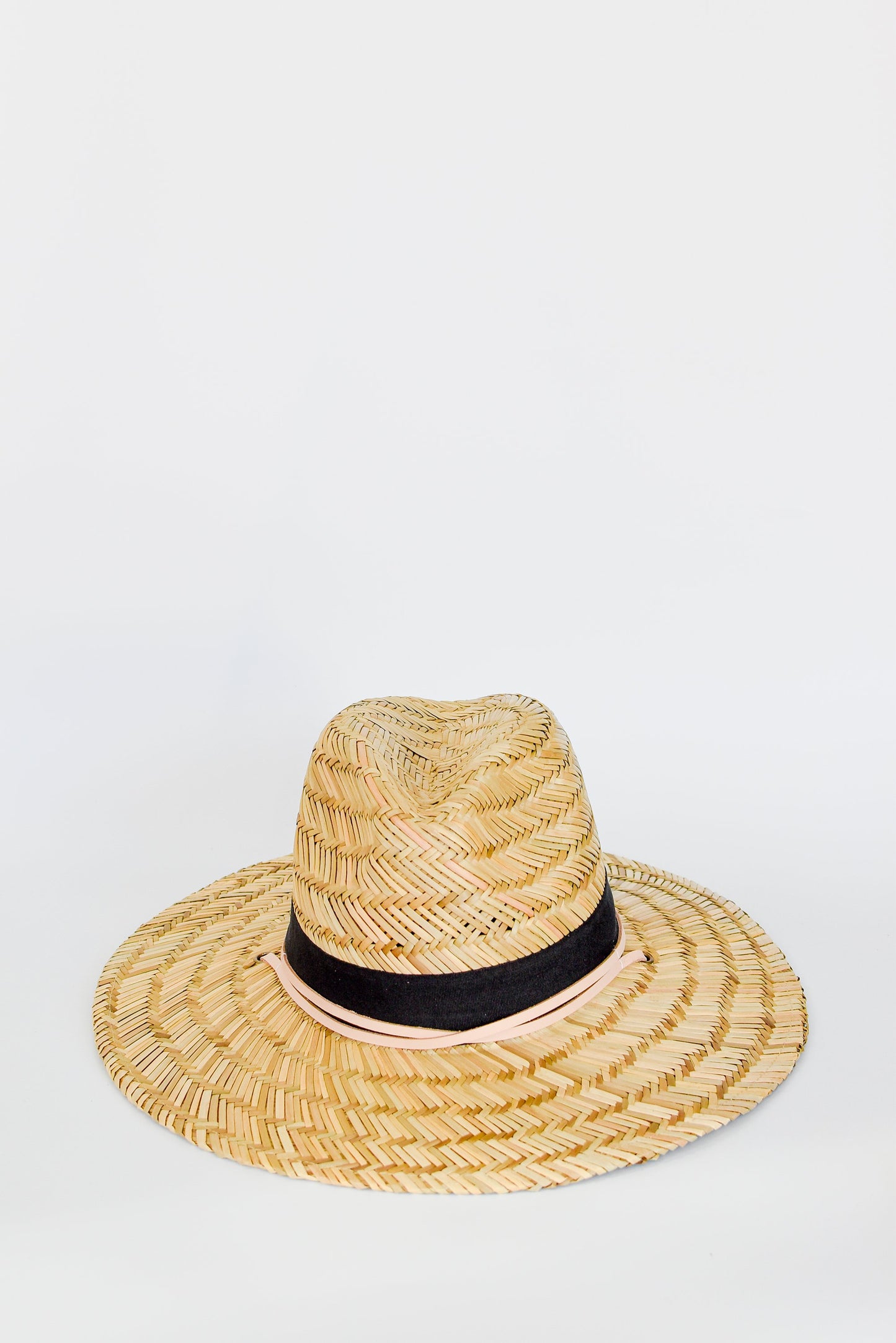 Straw lifeguard hat with tan leather chin strap and black band detail.
