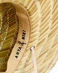 Close up of adjustable interior band on straw lifeguard hat. 