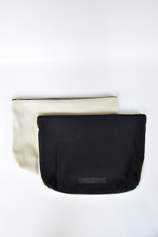 Black cotton canvas and off-white suede large pouch with brass zipper and leather logo label.