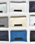 Collection of small limited edition leather and denim pouches from Anya & Niki. 