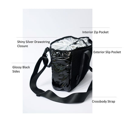 Small black mesh tote with glossy black sides, shiny silver cinch top and crossbody strap.