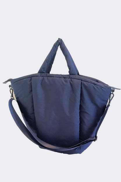 large puffy navy nylon tote bag with crossbody strap