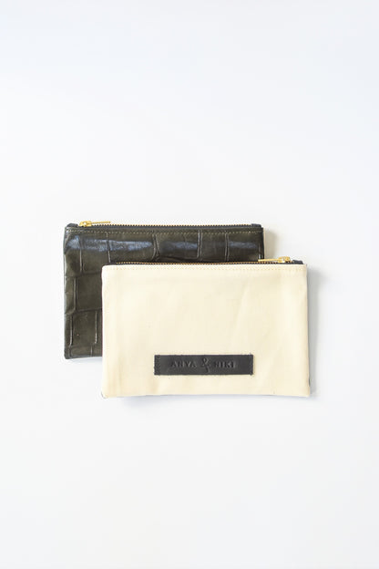 Ecru denim and army green embossed leather skin small pouch with brass zipper and leather logo label.