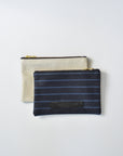 Striped dark denim and off-white croc embossed leather small pouch with brass zipper and leather logo label.