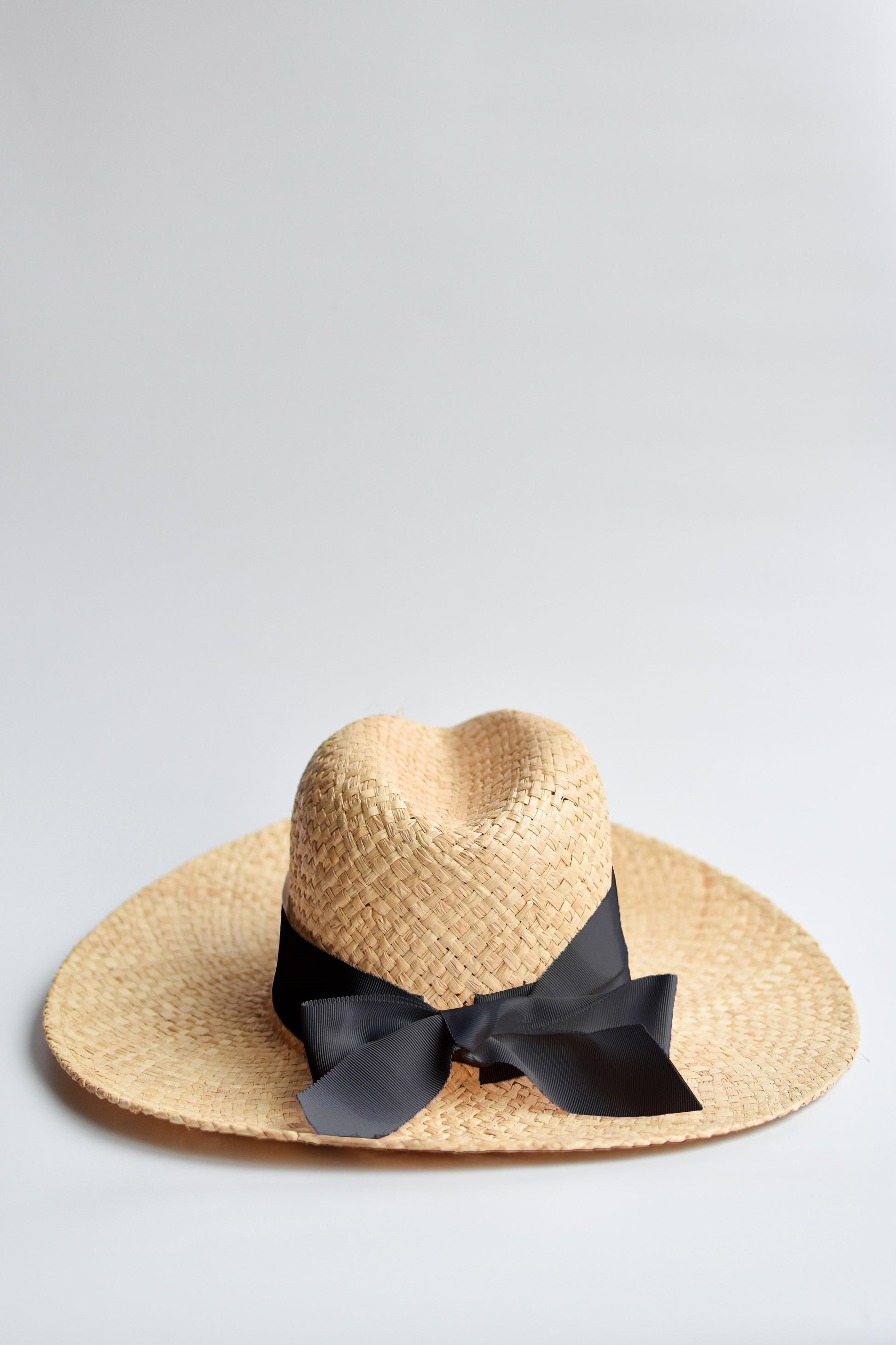 Raffia straw panama hat with black grosgrain tie